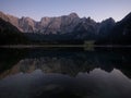 Alpine mountain lake landscape panorama reflection at Laghi di Fusine Weissenfelser See in Tarvisio Dolomites alps Italy Royalty Free Stock Photo