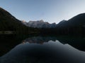 Alpine mountain lake landscape panorama reflection at Laghi di Fusine Weissenfelser See in Tarvisio Dolomites alps Italy Royalty Free Stock Photo