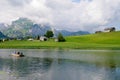Alpine mountain lake Schwendisee in Toggenburg. Saentis range in the background. St. Gallen, Switzerland. Royalty Free Stock Photo