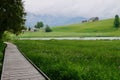 Alpine mountain lake Schwendisee in Toggenburg. Saentis range in the background. St. Gallen, Switzerland. Royalty Free Stock Photo