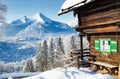 Alpine mountain scenery with cabin in winter