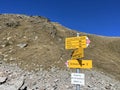 Alpine mountaineering signposts and markings in the mountainous area of the Albula Alps and above the Swiss mountain pass Fluela