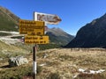 Alpine mountaineering signposts and markings in the mountainous area of the Albula Alps and above the mountain road pass Fluela