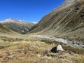 Alpine mountaineering signposts and markings in the mountainous area of the Albula Alps and above the mountain road pass Fluela