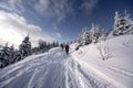 Alpine mountains landscape with white snow and blue sky. Sunset winter in nature. Frosty trees under warm sunlight. Wonderful wint Royalty Free Stock Photo