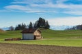 Alpine mountains spring landscape with wooden shed