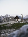 Alpine panorama of Cappella degli Alpini mountain chapel and Cadini di Misurina at Tre Cime Dolomites South Tyrol Italy Royalty Free Stock Photo