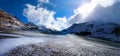 Alpine pass in switzerland, Julierpass in swiss alp with snow and cloudy sky Royalty Free Stock Photo