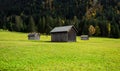 Alpine pastures and barns, panoramic landscape Royalty Free Stock Photo