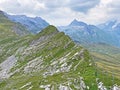 Alpine peak Tannenschild above the Tannensee lake or Tannen lake and in the Uri Alps mountain massif, Melchtal - Switzerland Royalty Free Stock Photo