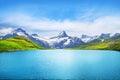 Alpine peaks landskape background. Bachalpsee lake, Grindelwald, Bernese highland. Alps, tourism, journey, hiking