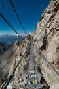 Alpine rope suspension bridge. Sentiero dei fiori, Tonale, Italy Royalty Free Stock Photo