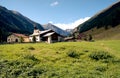 Alpine rural scene seen from a rocky ridge. Hiking in Swiss Alps.