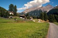 Alpine rural scene seen from a rocky ridge. Hiking in Swiss Alps.