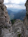 Alpine Serenity: Panoramic View Through Rocky Gateway Into Lush Valley