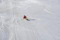 Alpine skier in pisted skisloope