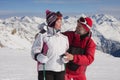 Alpine skiers mountains in the background