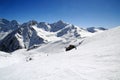 Alpine skiers on the slope of Mount Elbrus below the Mir station Royalty Free Stock Photo