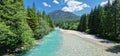 alpine stream with crystal blue water Royalty Free Stock Photo