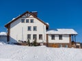 Alpine-style hotel in the Gornaya Salanga ski resort. Winter sunny day Royalty Free Stock Photo