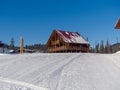 Alpine-style hotel in the ski resort Gornaya Salanga. Chalet in the snow