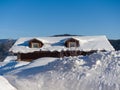 Alpine-style hotel in the ski resort Gornaya Salanga. Chalet in the snow