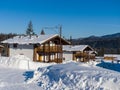 Alpine Village in the ski resort Mountain Salanga. Winter sunny day Royalty Free Stock Photo