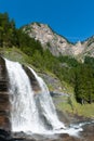 Alpine waterfall in mountain forest Royalty Free Stock Photo