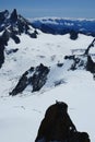Alpinist climbing Aiguille du Midi at 3842m, Mont Blanc massif Royalty Free Stock Photo