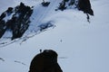 Alpinist climbing Aiguille du Midi at 3842m, Mont Blanc massif Royalty Free Stock Photo