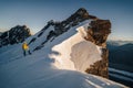 An alpinist climbing alpine peak in Switzerland