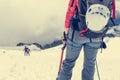 Alpinist looking down the slope.