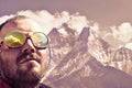 Alpinist looking at summit, mountain background