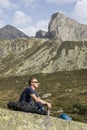 Alpinist meditates according to the meaning of life Royalty Free Stock Photo