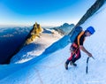 Alpinist mountaineer climbing snow ice mountain slope