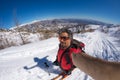 Alpinist taking selfie on snowcapped mountain, fisheye lens Royalty Free Stock Photo