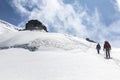 Alpinists ascend to the Cosmique refuge past Col du Midi in the French Alps, Chamonix Mont-Blanc, France
