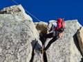 AIGUILLE DU MIDI, FRANCE - AUGUST 8, 2017: Alpinists climbing on rocks at Aiguille du Midi, Chamonix, France