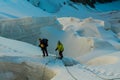 Alpinists on the glacier at high altitude snow mountains