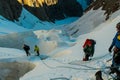 Alpinists on the glacier at high altitude snow mountains