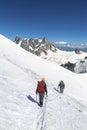 Alpinists with rope and climbing tools on Col du Midi in front of Grandes Jorasses, Mont Blanc massif in the French Alps, Chamonix Royalty Free Stock Photo