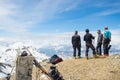 Alpinists on top at high altitude in the Alps