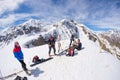 Alpinists on top at high altitude in the Alps