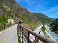 Alps Adria - Ciclovia Alpe Adria bike lane entering one of the many tunnels on the route, Val Canale valley, Udine