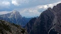 Alps behind mountains of Drei Zinnen, Tre Cime di Lavaredo in Dolomiten mountains, Italy