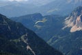 Alps. Dachstein Mountains. Austria. Paraplaner gliding in blue sky with view on Alpine mountains on paraplane Royalty Free Stock Photo