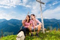 Alps - Hiking Couple takes break in mountains Royalty Free Stock Photo