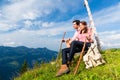 Alps - Hiking Couple takes break in mountains Royalty Free Stock Photo