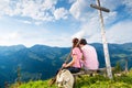 Alps - Hiking Couple takes break in mountains Royalty Free Stock Photo