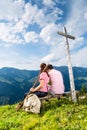 Alps - Hiking Couple takes break in mountains Royalty Free Stock Photo